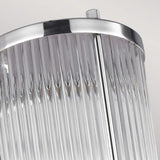 Close-up of the Paulson 1 Light Wall Light in chrome, featuring a modern glass tube shade with a cylindrical shape. The polished chrome design beautifully reflects light, adding a sleek, contemporary touch perfect for use as an IP44 bathroom light.