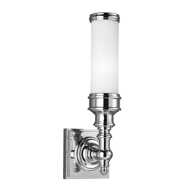 The Payne-2 1 Light Wall Light in polished chrome features a cylindrical opal etched glass shade and an ornate base connected to a square backplate, subtly evoking Tudor style.