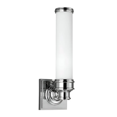 The Payne-1 1 Light Wall Light features a minimalist design with clean lines and a sleek industrial look. It includes a cylindrical white opal etched glass shade in a polished chrome finish, mounted on a square base, and is IP44 rated for modern styling.