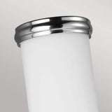 A close-up of the Payne-1 1 Light Wall Light - Polished Chrome against a light gray background. The sleek and modern design, resembling white opal etched glass, is highlighted by its shiny silver rim and smooth surface.