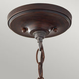 The Pickering Lane 3 Light Semi Flush - Bronze is displayed against a light gray background, featuring a rustic farmhouse design. Its hanging chain links attach to the center of the round, bronze canopy, enhancing its charming appeal.