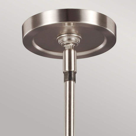 Close-up of the Prospect Park 3 Light Island Chandelier, showcasing a modern metallic ceiling mount with a sleek circular ceiling plate and cylindrical rod. Its satin nickel finish provides a contemporary, polished look that perfectly complements the opal etched glass or chandelier designs.