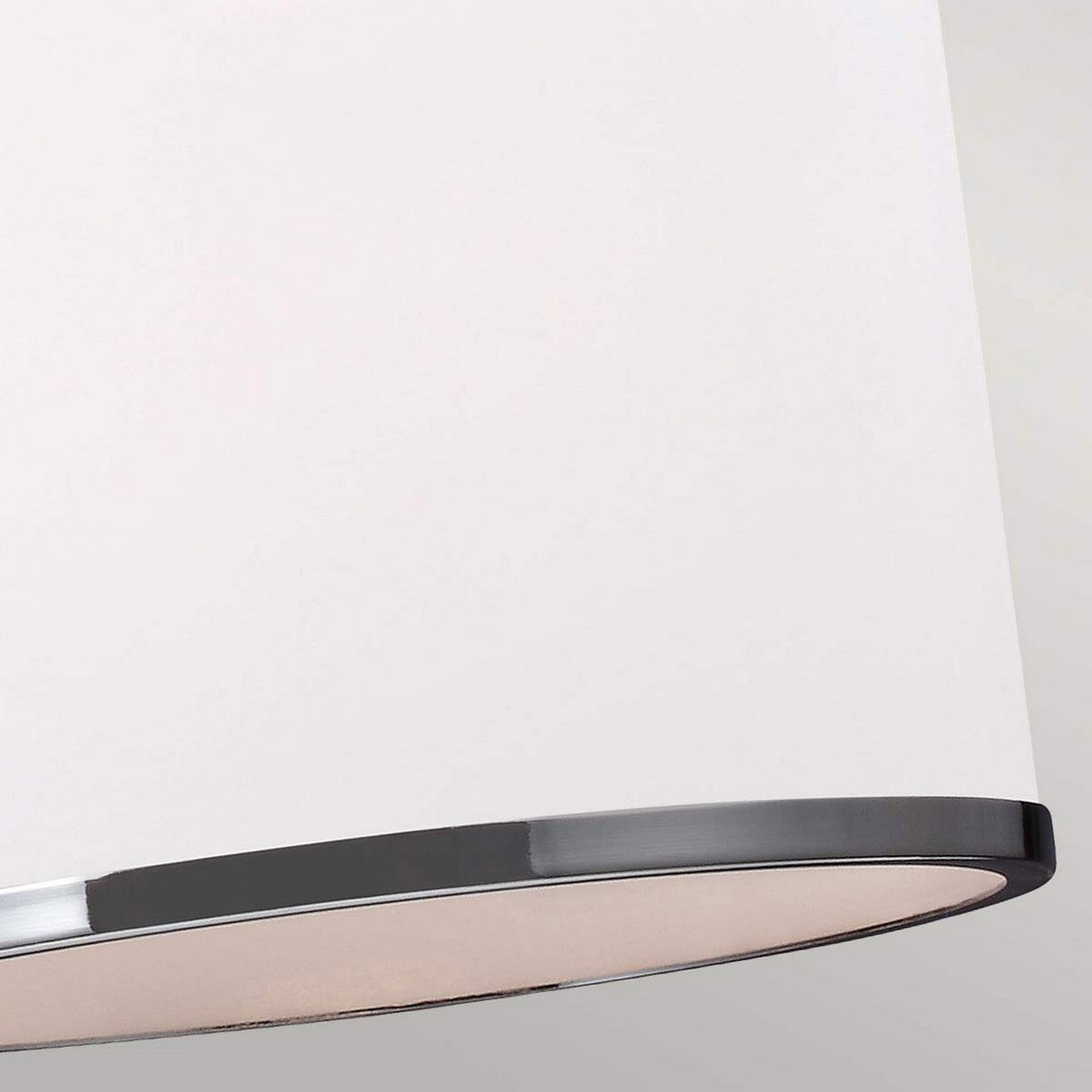 The Prospect Park 3 Light Island Chandelier features a modern lampshade with a smooth white surface complemented by a shiny satin nickel rim, highlighting its minimalist design. The fixture showcases opal etched glass details in a soft, neutral color palette.