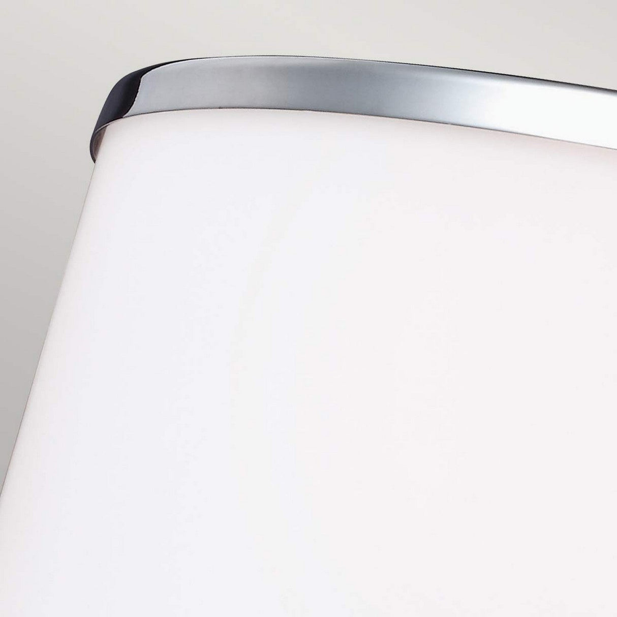 Close-up of the Prospect Park 4 Light Chandelier featuring a modern white shade with a sleek satin nickel and chrome finish, reminiscent of Opal Etched glass shades, set against a neutral background. The design is minimalistic and contemporary, embodying the essence of modern lighting.