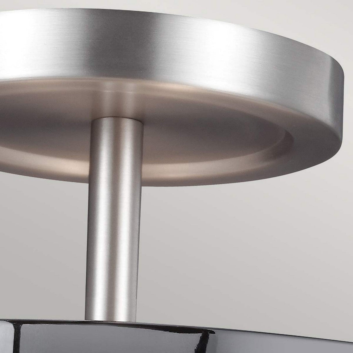 Close-up of the Prospect Park 2 Light Semi Flush, featuring a modern metallic design in satin nickel with chrome accents and opal etched glass. The circular fixture adds sophistication against a light gray background.