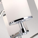 Close-up of the Prospect Park 9 Light Chandelier showcasing opal etched glass shades and chrome accents. The image emphasizes its sleek design, satin nickel finish, and intricate detailing, embodying a contemporary style.
