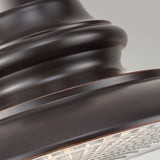 A close-up of the Redding Station 1 Light Outdoor Medium Chain Lantern in Dark Bronze reveals a rounded, layered design with a smooth and glossy metal surface. The lantern encases the bulb beneath textured glass, exuding elegance that enhances any sophisticated outdoor setting.