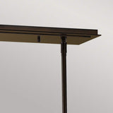 A close-up of the Remy 4 Light Pendant Chandelier showcases its dark metal structure, enhanced by a Parisienne Gold finish. The minimalist design, featuring clean lines and a modern aesthetic, stands out beautifully against a neutral background.