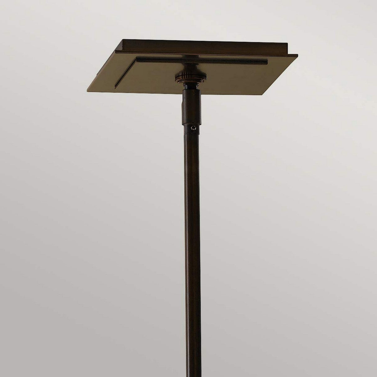 The Remy 1 Light Chandelier, featuring an adjustable rod and square base for ceiling installations, exhibits artisan craftsmanship with a stunning Heritage Bronze finish enriched by Parissiene Gold accents, enhancing its aesthetic allure.