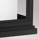 Close-up of the Roscoe 1 Light Outdoor Medium Wall Lantern in black, featuring a rectangular frame with a matte finish against a white background. The lantern boasts straight, clean lines and rests on a flat surface with a slightly elevated base. The image emphasizes the corner and edge details, highlighting its sleek design.