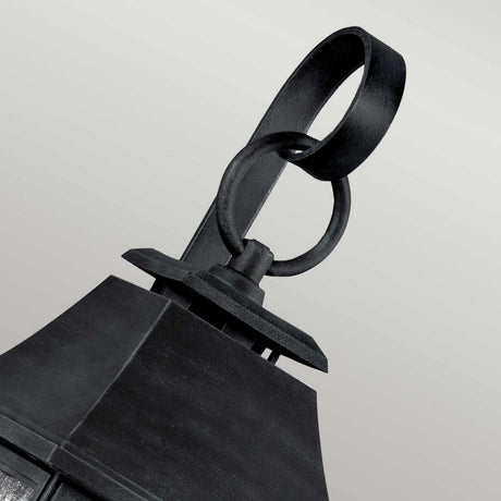 Close-up of the Shepherd 2 Light Outdoor Medium Wall Lantern in dark weathered zinc, exuding a vintage Parisian design with a loop at the top, set against a plain gray background.