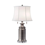 The Stateroom 2 Light Table Lamp - Antique Nickel features a sophisticated silver design with a white, slightly tapered cotton linen shade. Its antique nickel base provides a modern flair, while two pull chains offer flexible lighting control.