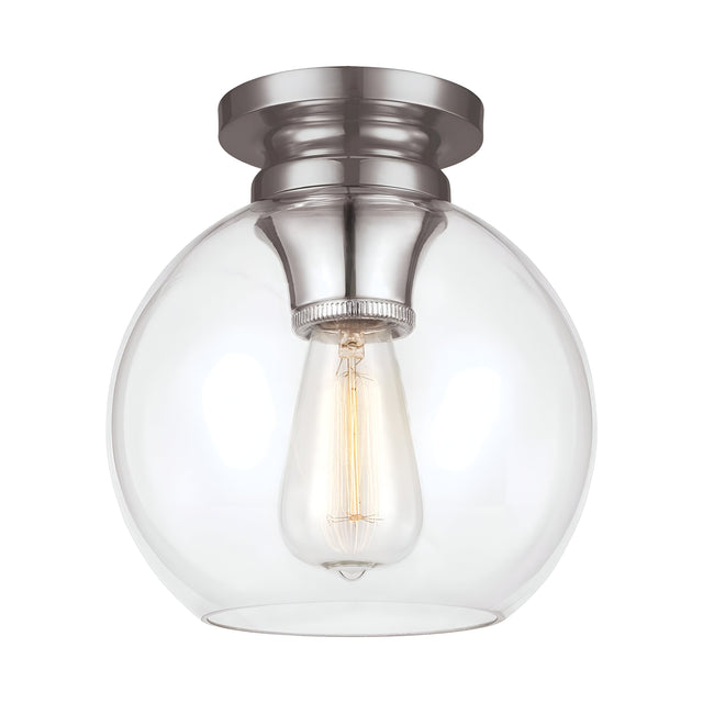 The Tabby 1 Light Flush - Polished Nickel is a ceiling-mounted fixture that showcases a round, clear glass globe with an exposed filament bulb. The base features a polished nickel finish with a brushed texture. This piece combines contemporary lighting design with simplicity, offering a warm and inviting glow.