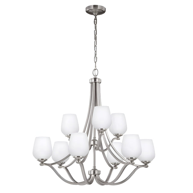 The Vintner 9 Light Chandelier in a satin nickel finish features eight opal etched glass shades, stylishly arranged in two tiers. The fixture hangs from a chain, highlighting its sleek, curved design.
