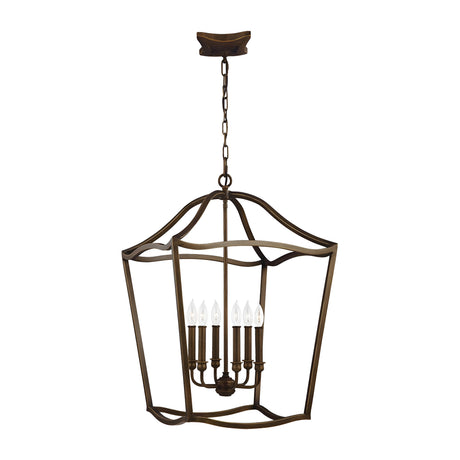 The Yarmouth 6 Light Chandelier, now available in a painted aged brass finish, features a lantern-style design with an open geometric frame and six candle-shaped bulbs arranged in a circular pattern. Hanging from a chain, this fixture exudes the charm of traditional lanterns with its classic, rustic appeal.