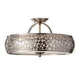 Introducing the Zara 3 Light Semi Flush - Brushed Steel fixture, showcasing a sleek brushed steel finish. This silver semi-flush ceiling light is designed with a geometric mosaic-patterned shade composed of interlocking metal pieces and a circular frame, offering a modern and decorative touch to any contemporary decor.