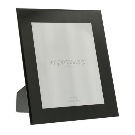 Plain bevelled glass photo frame in black for a 10 x 8in picture, rectangular with a wide glossy border and rear stand, shown on a white background.
