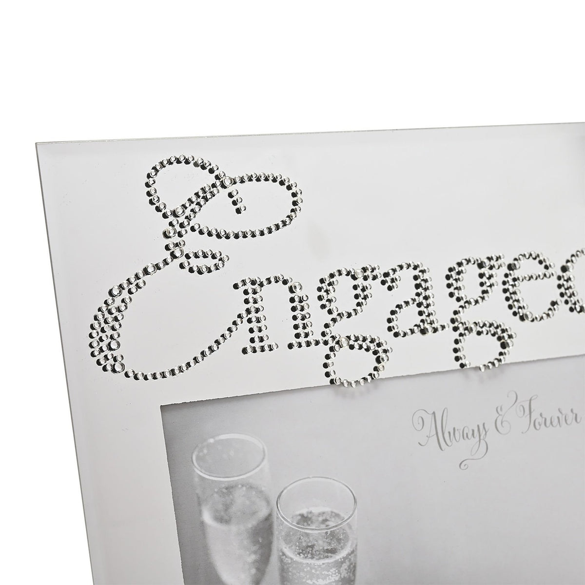 Close-up of the Engaged Crystal Word Mirror Glass Photo Frame, 6 x 4in, with "Engaged" in silver crystals above a mirrored surface framing a champagne glasses photo.