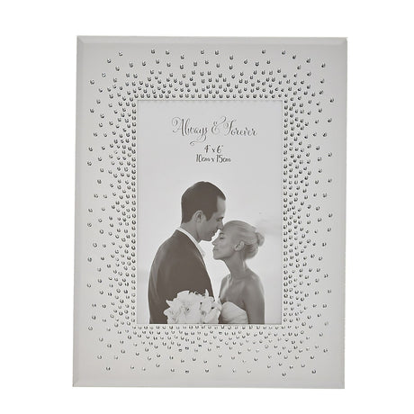 Rectangular mirrored photo frame in silver with a dense starburst of clear crystals around the opening, holding a 4x6 wedding couple photo on a white background.
