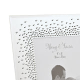 Close-up of a rectangular mirrored photo frame with a silver finish, showing dense starburst crystal detailing in one corner and "Always & Forever 4"x6"" text etched on the mirror.