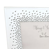 Close-up of the Wedding Mirror Photo Frame in silver, showing starburst crystal detailing and engraved "Always & Forever" text with 5"x7" sizing on a mirrored surface.