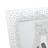 Close-up of a rectangular mirrored photo frame corner with dense clear starburst crystals on a bright silver mirror finish, "Always & Forever 8x10" engraving visible near the opening.