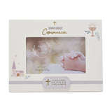 White wooden First Holy Communion photo frame, 6x4in, with gold cross and script text, rose-gold chalice, and pink church motif, holding a sample image of praying hands.