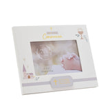 White wooden First Holy Communion photo frame, 6x4in, with gold cross and script text, rose-gold chalice, and pink church motif, holding a praying hands photo.