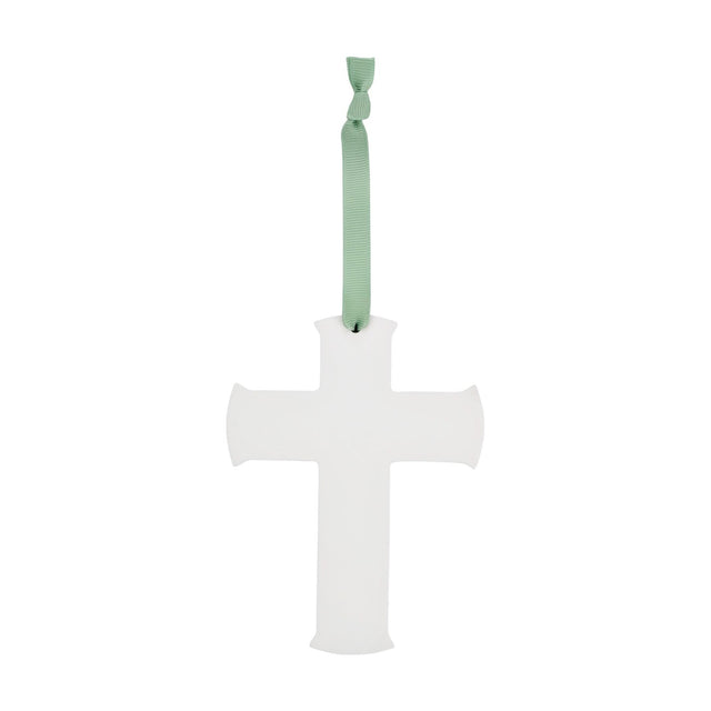 White matt hanging cross plaque with plain flared arms, suspended from a green ribbon bow, shown on a plain white background.