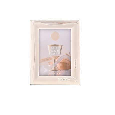 Rectangular silverplated photo frame with a smooth silver surround, curved line detail, and a wheat sprig design in the lower corner, shown with a sample photo on a white background.