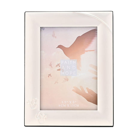 Silverplated rectangular photo frame with a broad polished silver border, two fine outline doves in the lower left corner, holding a 5 x 3.5in portrait photo on a plain white background.