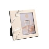 Cream silverplated square photo frame with raised chalice and wheat sprig design, holding a 5 x 3.5in portrait photo, shown at an angle on a plain white background.