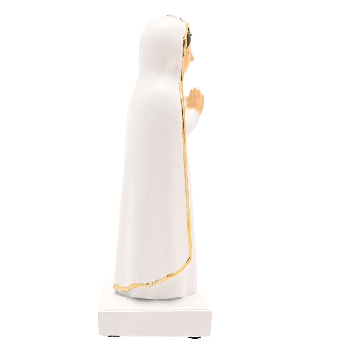Side view of Praying Mary resin figurine in white with gold edging on her veil, hands pressed together in prayer, standing on a square base against a plain white background.