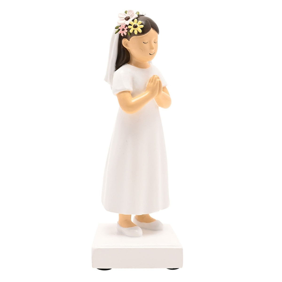 Communion Girl Figurine in resin with dark brown hair, white dress and veil, flower crown, hands clasped in prayer, on a white square base against a plain background.