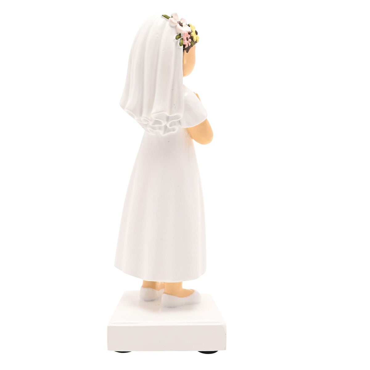 Communion girl figurine in resin, side view, showing dark brown hair under a white veil with floral crown, white dress, hands clasped in prayer, on a square white base against a plain background.