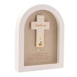 White arched wooden plaque with a cream cross reading "Christening" in gold script, set in a beige recess with candle motif and gold heart detail.