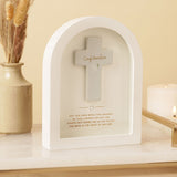 Arched white wooden plaque with a grey raised cross reading "Confirmation" in gold script, a silver heart, and a gold verse, displayed on a shelf beside a candle and dried flowers.