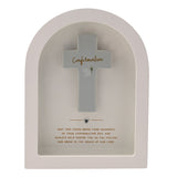 Arched white wooden plaque with a raised grey cross reading "Confirmation" in gold script, a dove and sprig motif, silver heart detail, and a gold verse below, on a plain background.