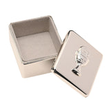 Rectangular silver metal keepsake box with soft-grey lined interior, shown open beside its lift-off lid featuring a raised chalice and IHS host design, on a plain white background.