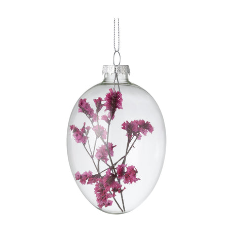 Fintry Decorative Egg hanging ornament in clear glass with pink dried flower sprigs inside, silver cap and loop at top, shown on a plain white background.