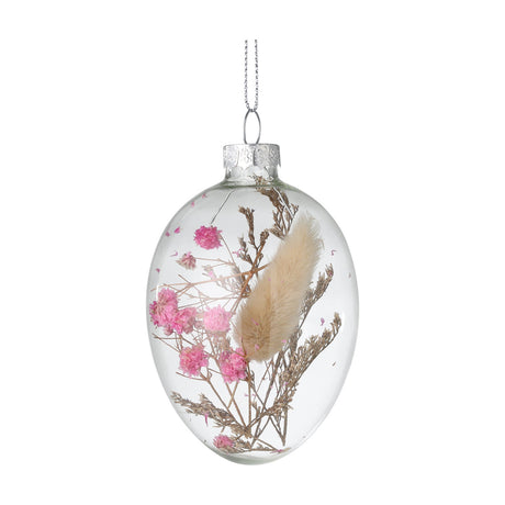 Fintry Decorative Egg, a clear glass hanging ornament with pink dried flowers, brown sprigs and a cream grass plume, topped with a silver cap and hanging loop on a white background.