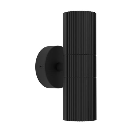Firvette 2 Light Outdoor Wall Light in black, fluted cylindrical aluminium body on a round wall plate, shining up and down, shown on a plain white background.
