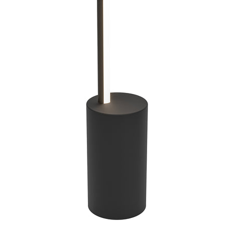 Close-up of the Flatron Smart LED Floor Lamp's matt black cylindrical base with a slim illuminated light rod rising from it, shown against a plain white background.