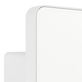 Close-up of the Flenvenne LED flood light in white, showing the rounded rectangular aluminium body and plastic front panel with a visible seam, mounted on an angled wall bracket.