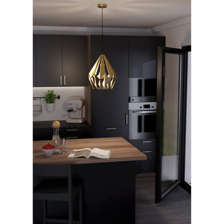 Flermanne 31cm pendant light with a faceted gold steel shade on a black cord and matching ceiling rose, shown above a wooden kitchen island in a dark matte kitchen.