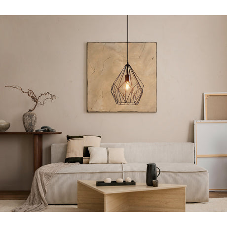 Flermanne Pendant Light 31cm in black steel wire with a faceted, open geometric cage and single E27 bulb, hanging above a sofa in a living room setting.