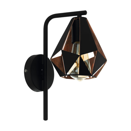 Flermanne wall light with a curved black arm, round wall plate, and faceted steel shade featuring open triangular panels with an antique copper interior, shown on a white background.