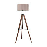 Flivelle floor lamp with a taupe fabric drum shade, walnut wood tripod legs and black steel joints, shown on a plain white background.