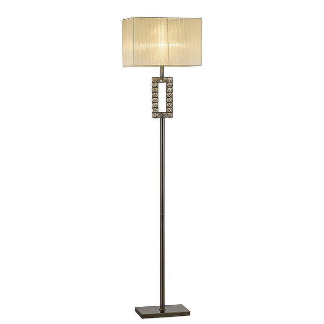 The Florence Rectangle 1 Light Crystal Floor Lamp features a brass slim metal stand, a decorative geometric section with crystal accents near the top, and a modern cream rectangular shade. It is dimmable for customizable lighting.