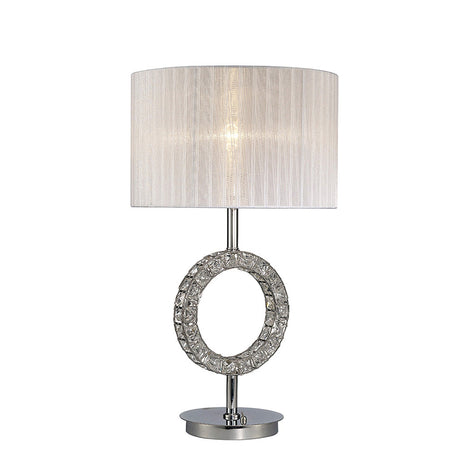 The Florence Round 1 Light Crystal Table Lamp features a modern chrome finish, a decorative textured ring on its circular base, and is topped with a white cylindrical shade for softly diffused light.